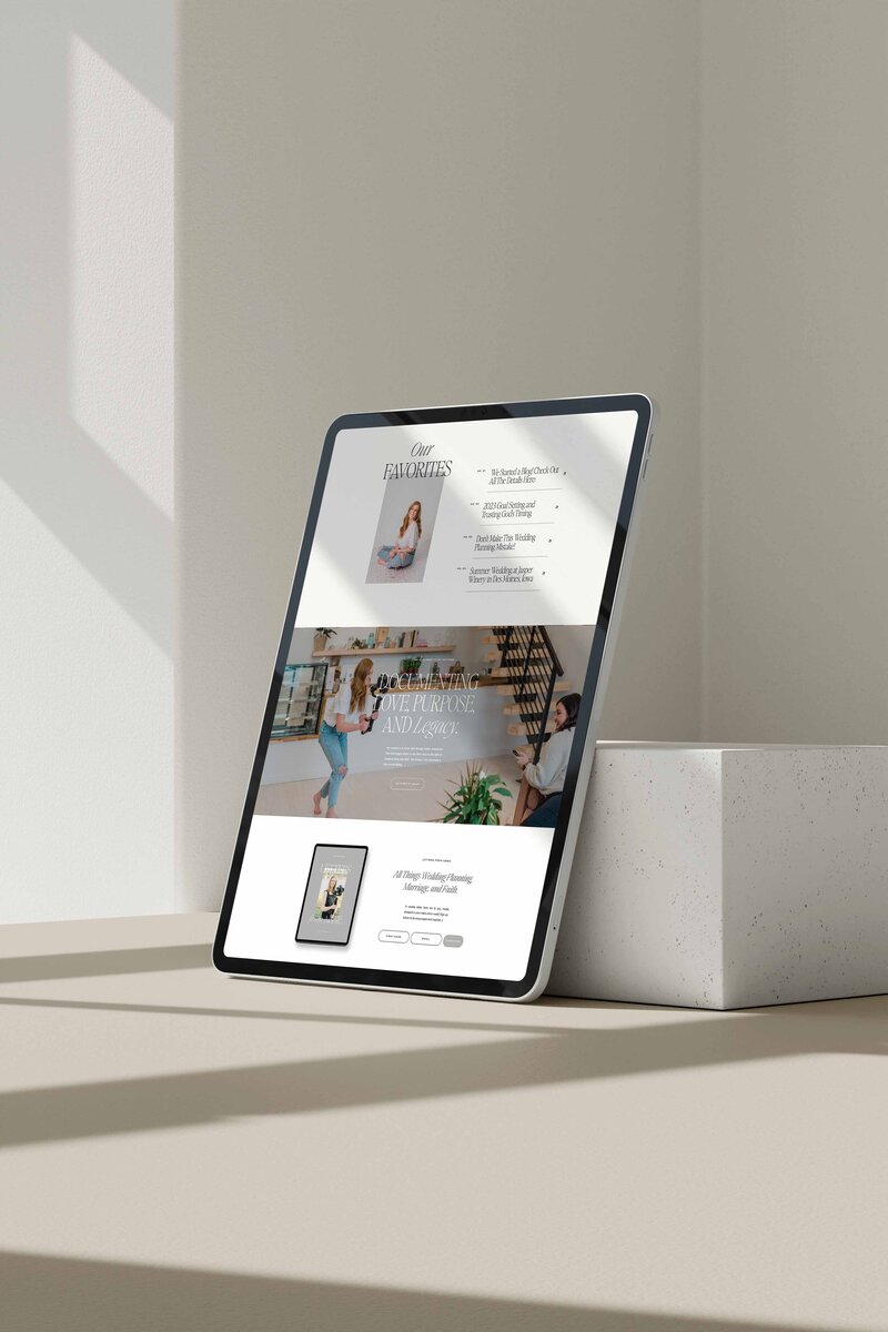 iPad screen featuring Iowa wedding videographer website