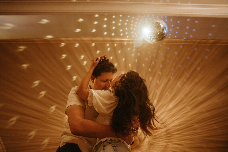 couple dancing under a disco ball