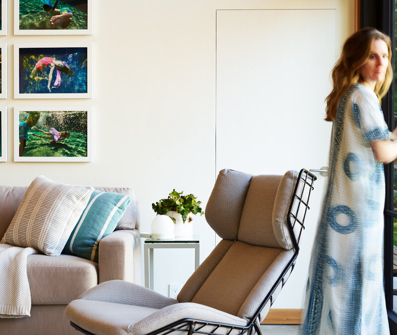 Interior designers in Boston Sarah Scales creates modern pool house in Hingham featuring a cool chair, simple architecture, and blue caftan styling elements.