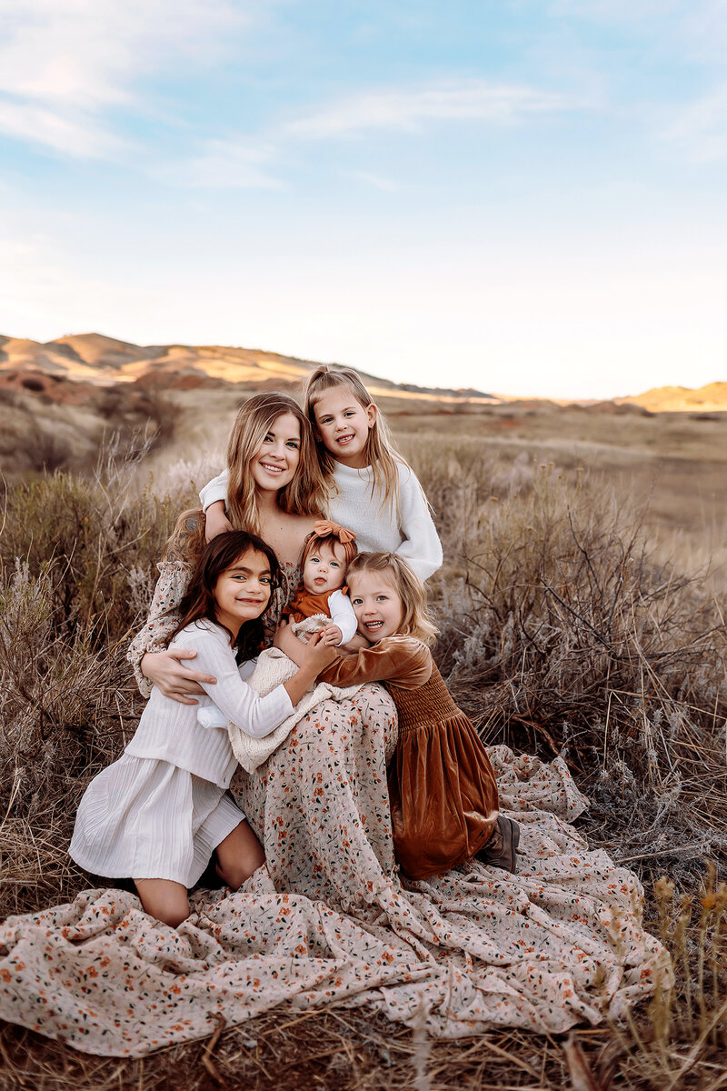 fun loving family session in sunflower field of windsor, co