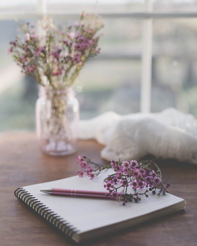 image of a journal and a pen