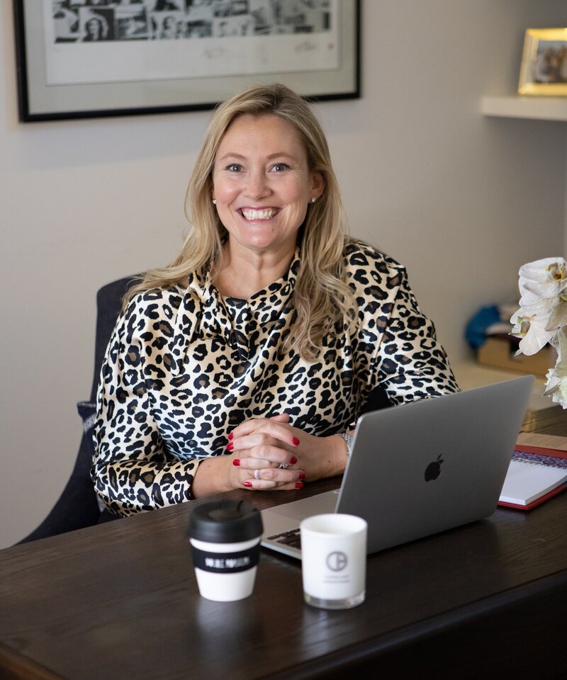 Confident woman in white jacket