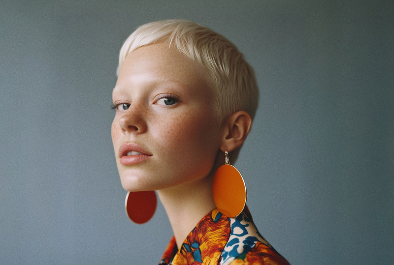 portrait_of_a_person_with_platinum_blonde_hair_and_bold_accessories_1