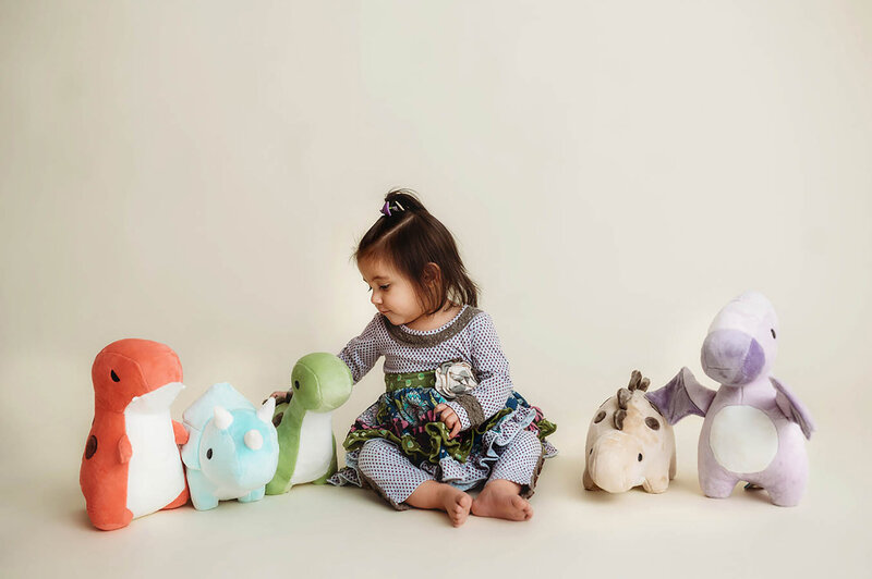 Family Poses with their Infant during Newborn Photoshoot in Asheville, NC.