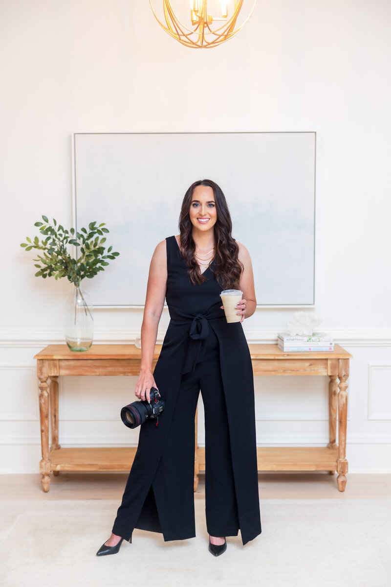 Monica Terrero Tallahassee Wedding Photographer posing with camera.