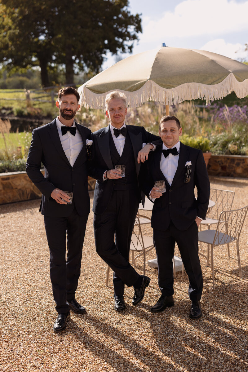 Wedding photographer captures couple taking a stroll hand in hand at their french chateau wedding.