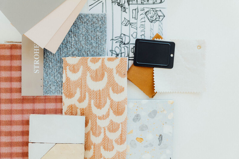 A flat lay with a sketch and fabric samples represents the  interior design planning process of Winsome Home Interiors. 