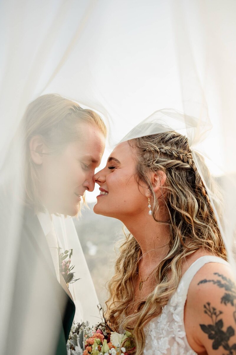 Wedding Day bride and groom having a cute moment. Captured by Michelle Betz Photography