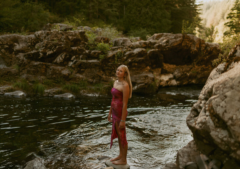 girl standing in river at washington nature park