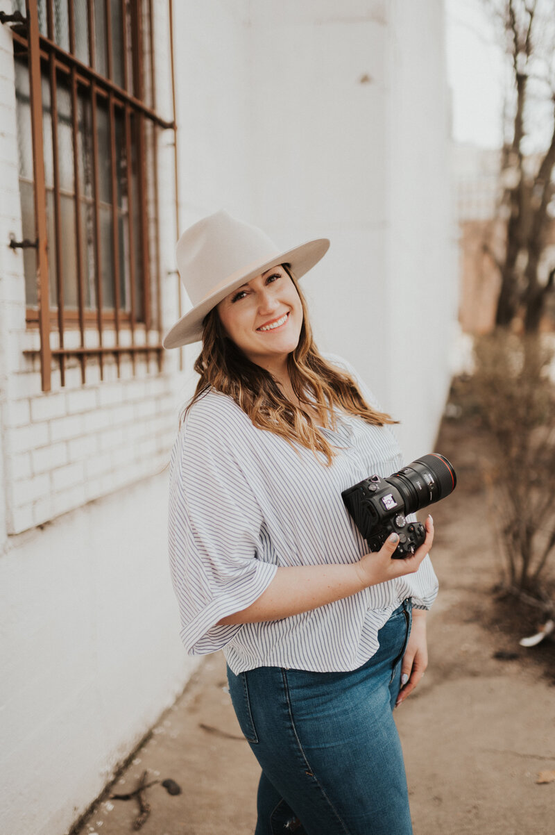 Mattie of Mathilda Louise Photography holding a camera