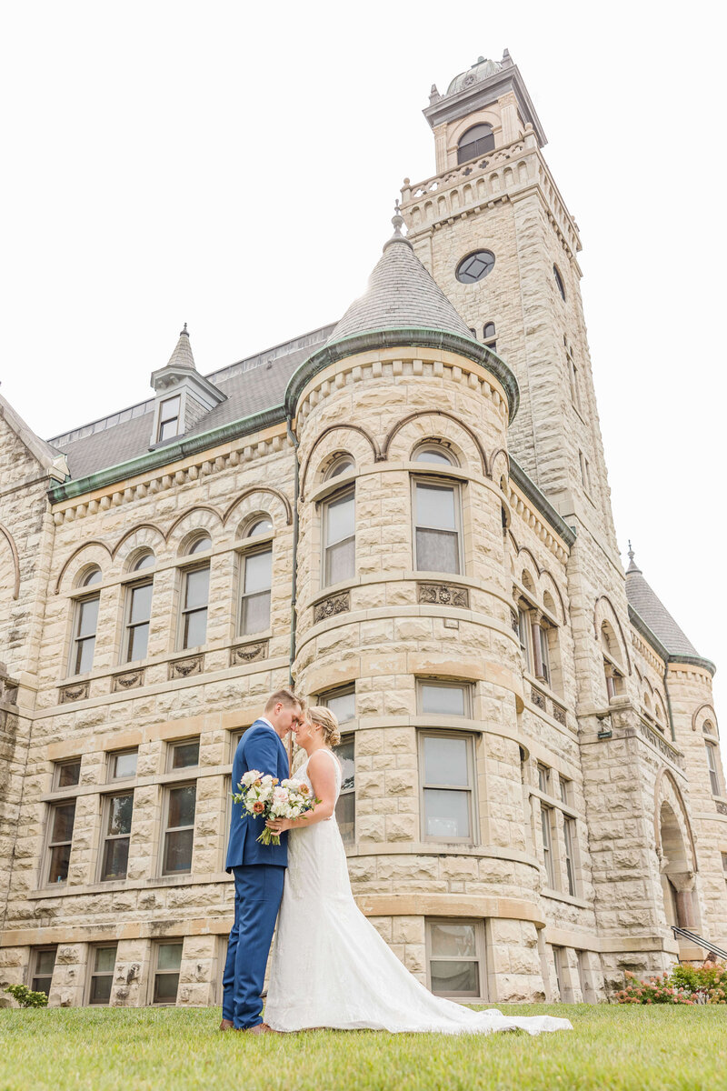 Bride and Groom in front of Historic Courthouse 1893 in Waukesha, Wisconsin.