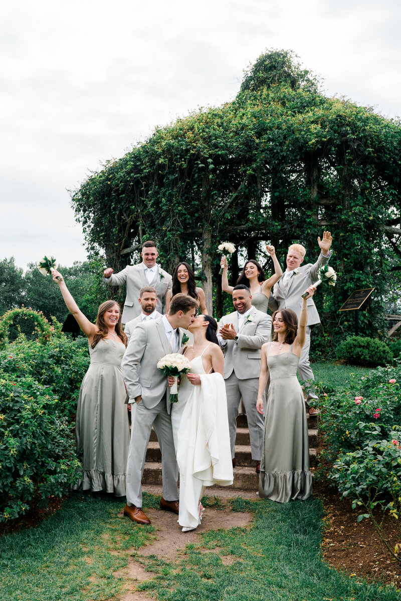 Wedding Photographer Newport RI | Rhode Island Caprio Captured Photography | Bride And Groom Holding a Champagne Glass While Smiling