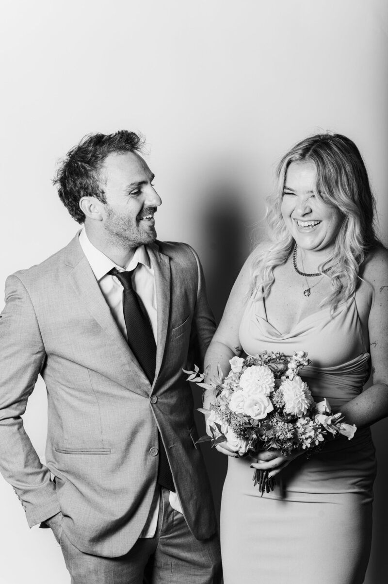 Timeless black and white couple portrait captured by a professional photographer at a Vogue Portrait photo booth in Richmond VA.