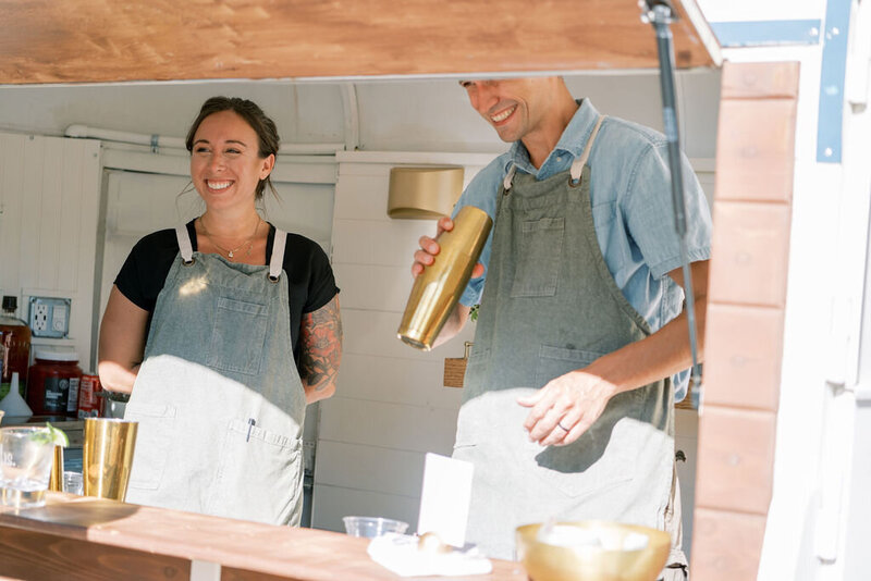 bartender taking orders inside the trailer