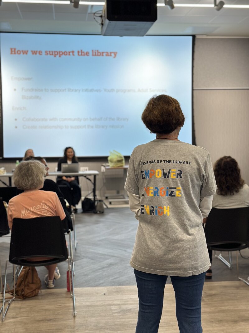 FOL Membership director, Cathy, wearing a Friends t-shirt at a meeting