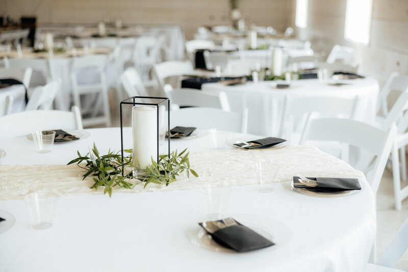 A black and white table setting at the reception.