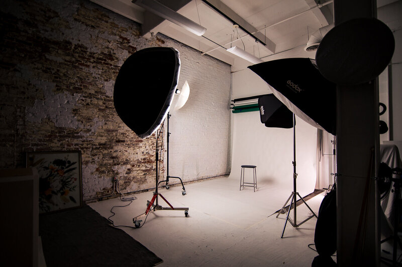 the all white seamless background set up with lighting at the Pittsburgh portrait studio.