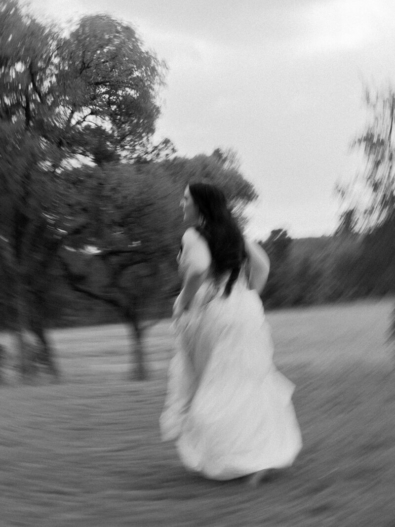 Mikaela Kahn live wedding vocalist running in a field