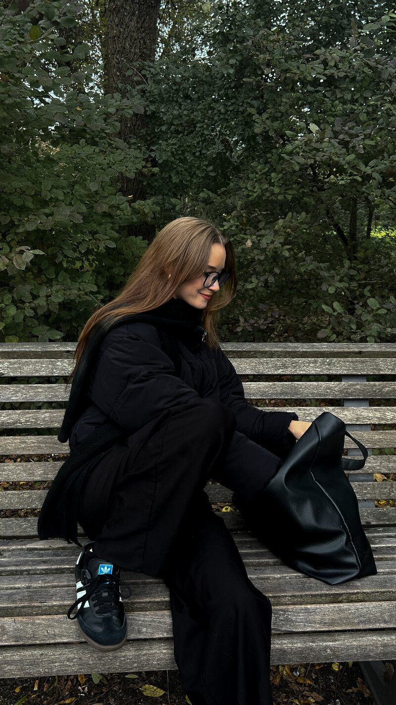 A woman laying down with her hand over her eyes. Showing someone waiting to start anxiety counseling in lower Manhattan. With the support of a therapist anxiety therapy can get her learn coping tools.