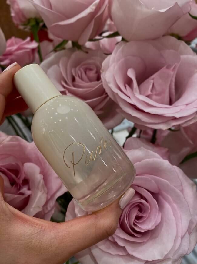 cream bottle with gold calligraphy engraving 