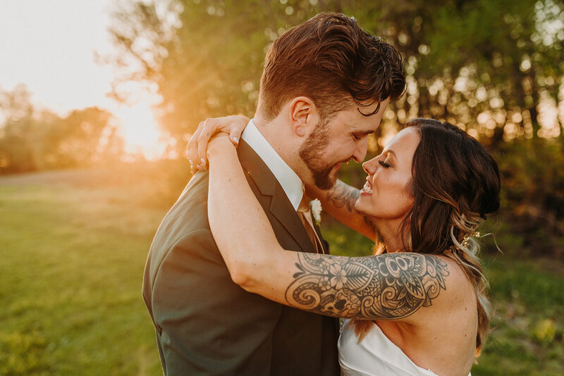 Bride and Groom smiling at each other
