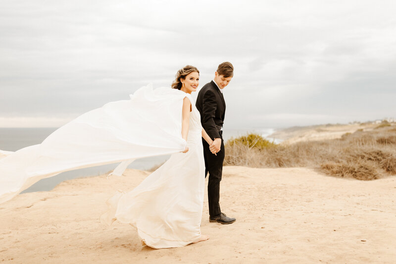 bride and groom at cliffside elopement in Southern California