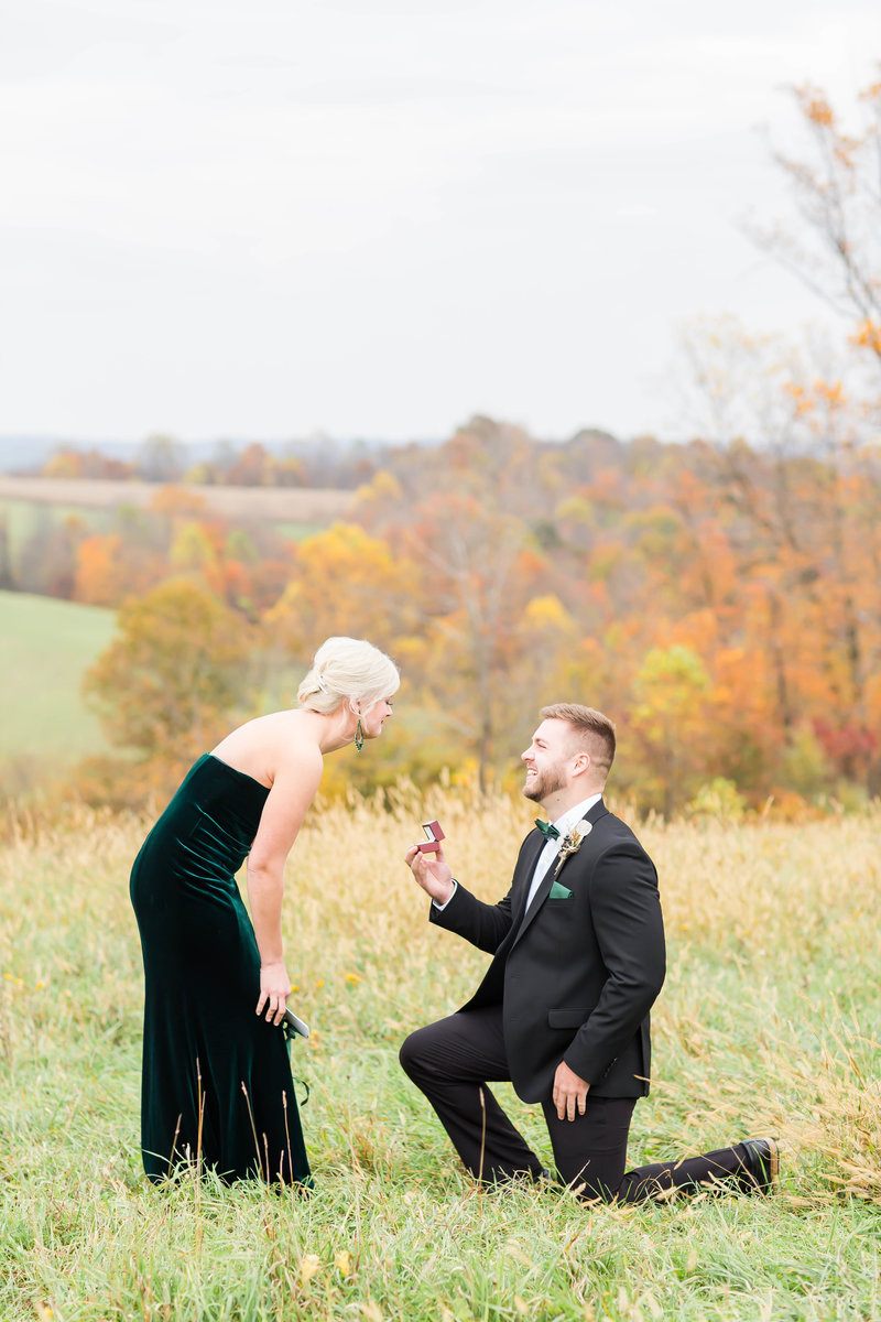Bride and Groom standing in front of floral arch at Purcell Mansion in Ohio photographed by akron ohio wedding photographer
