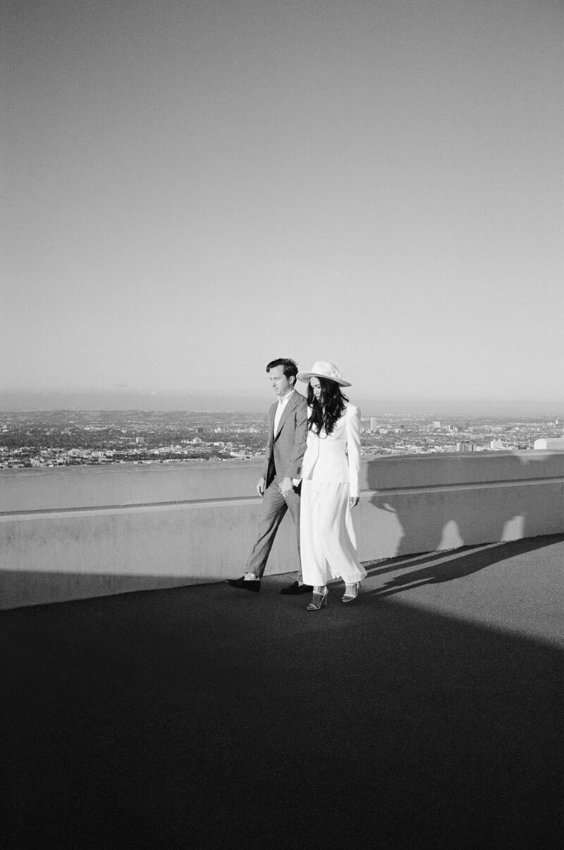 Chic couple pose for engagement portraits at Griffith Observatory