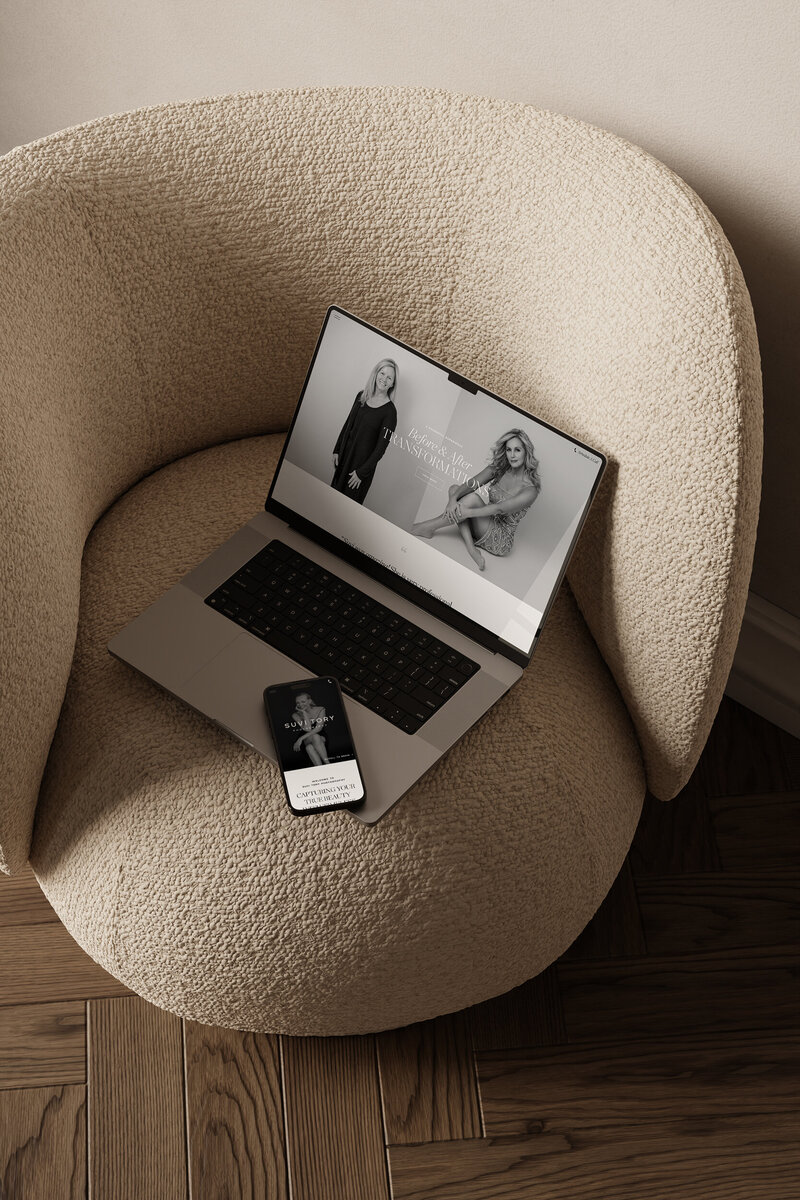 Laptop and mobile display of a custom Showit website design for master portrait photographer, styled on a boucle chair—created by expert Showit website designer and brand strategist at A Design Haus.