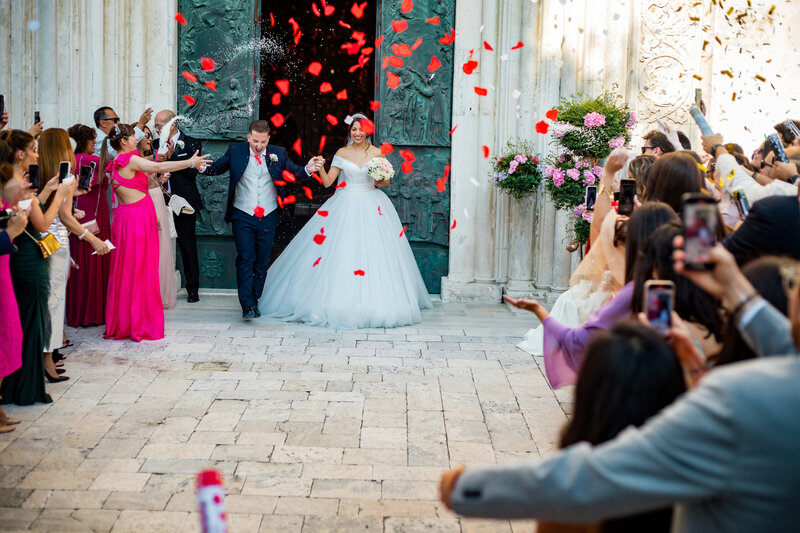 bride and groom leave church