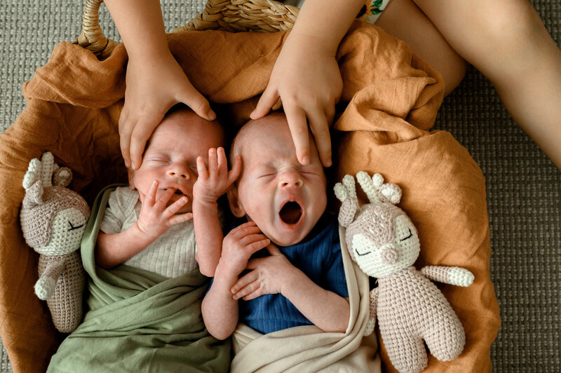 Mother holding baby's finger