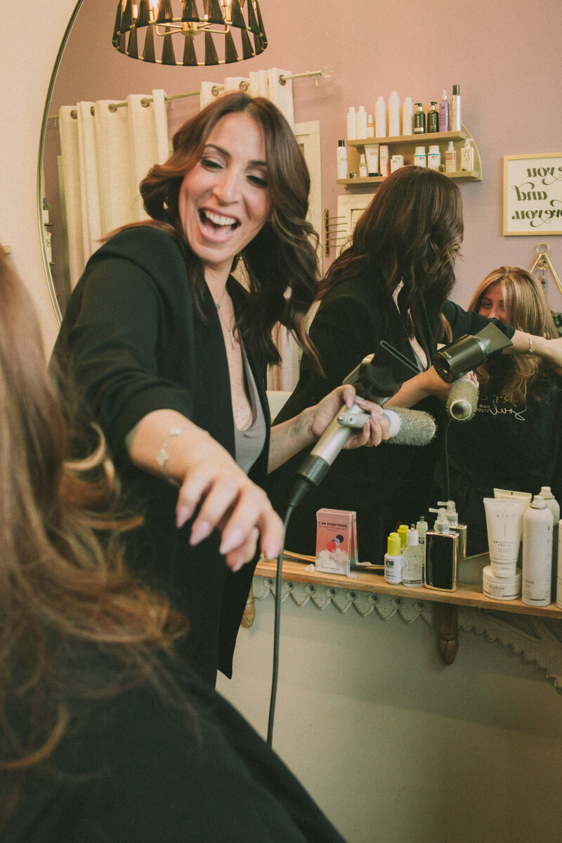 Amy Taylor, owner and hairstylist at Art & Soul Hair Studio in New York working on a client
