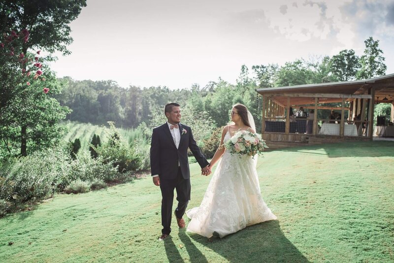 couple holding hand at north ga wedding venue