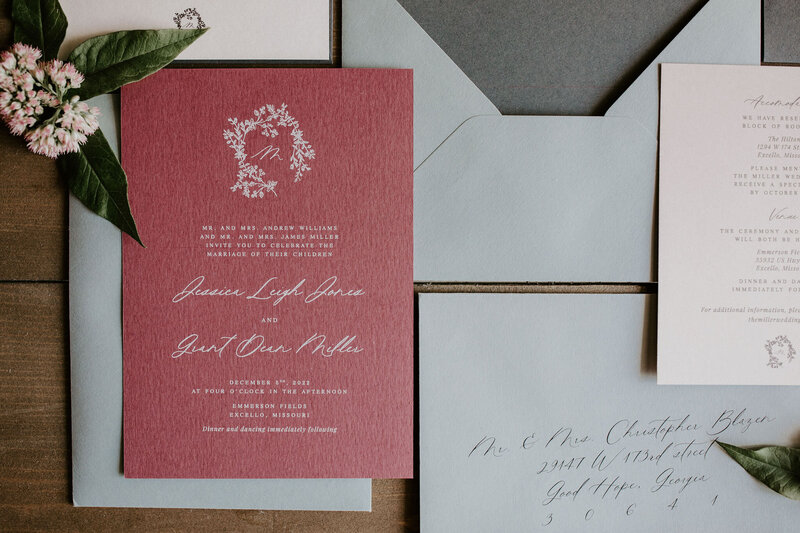 Classic red wedding invitation with white envelopes