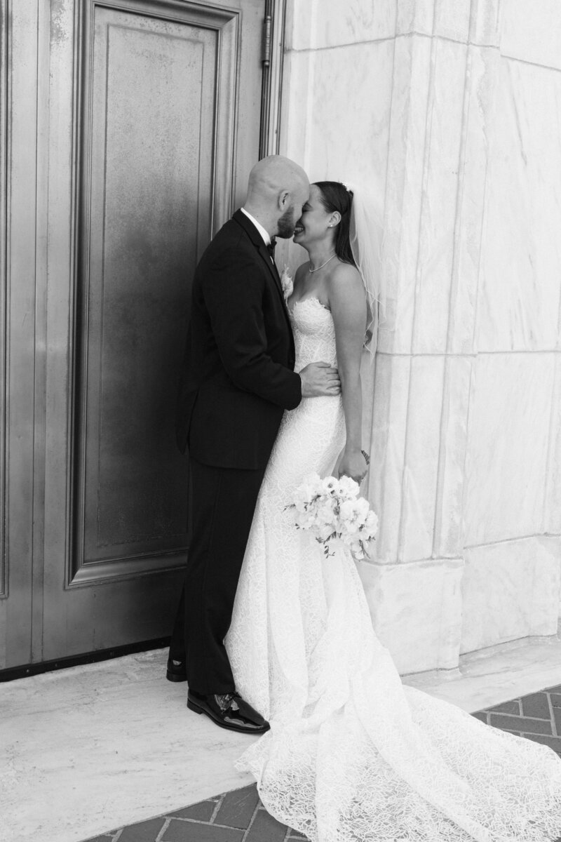 Couple poses elegantly during outdoor wedding photography session.