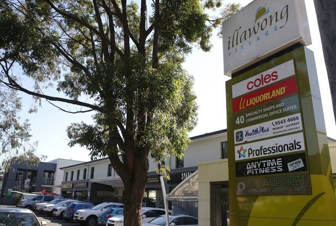 Signage and retail exterior of Illawong Shopping Village in NSW, refurbished by Serlana including lift and tenancy upgrades.
