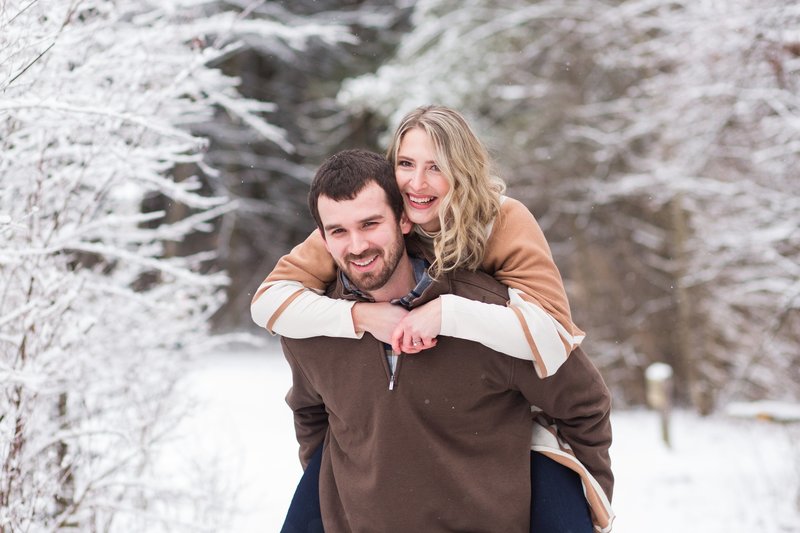 snowy engagement photos at quail hollow state park in hartville ohio photographed by Jamie Lynette Photography  Canton  Wedding and SeniorPhotographer