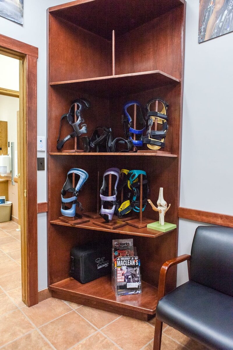 Shelf displaying custom-fit knee braces, mobility devices with tailored adjustments for optimal comfort.