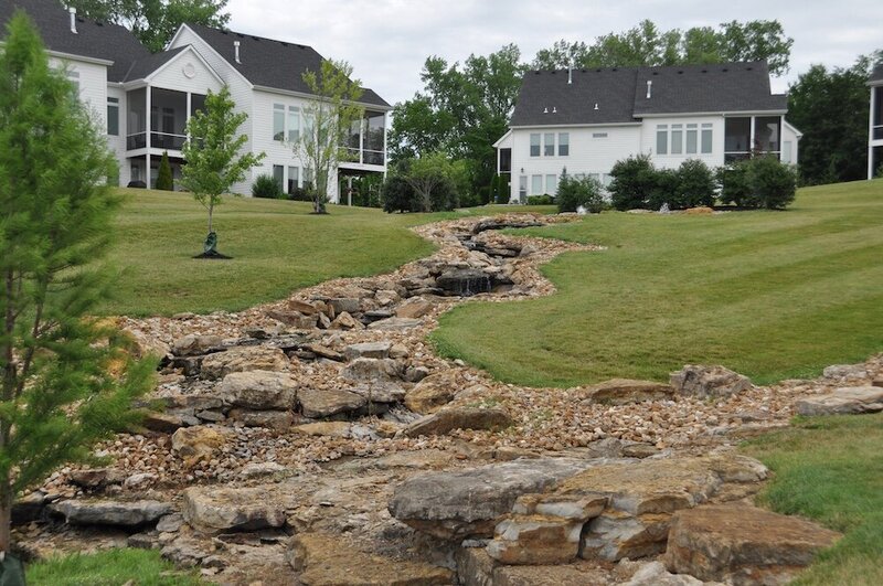 Residential landscape company project in Kansas City featuring a dry creek bed