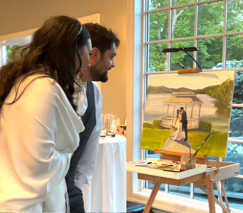 couple looking at wedding painting