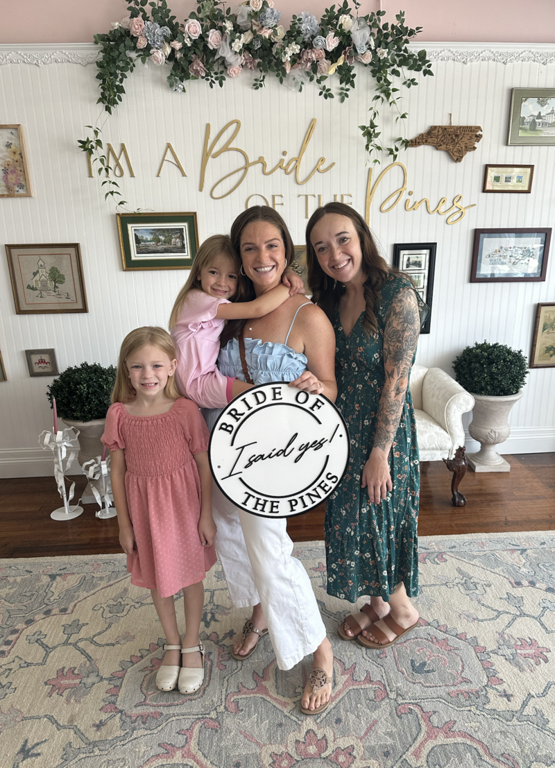 bride holding I said yes sign in Aberdeen NC Wedding dress store