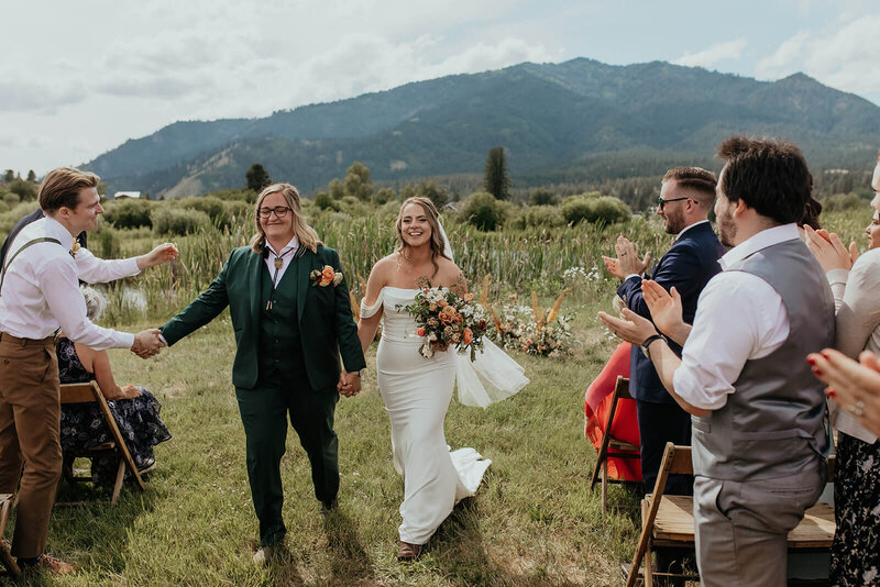 Two brides walking up the aisle, representing how Perfect Thirds & Co is an ally for the LGBTQ community
