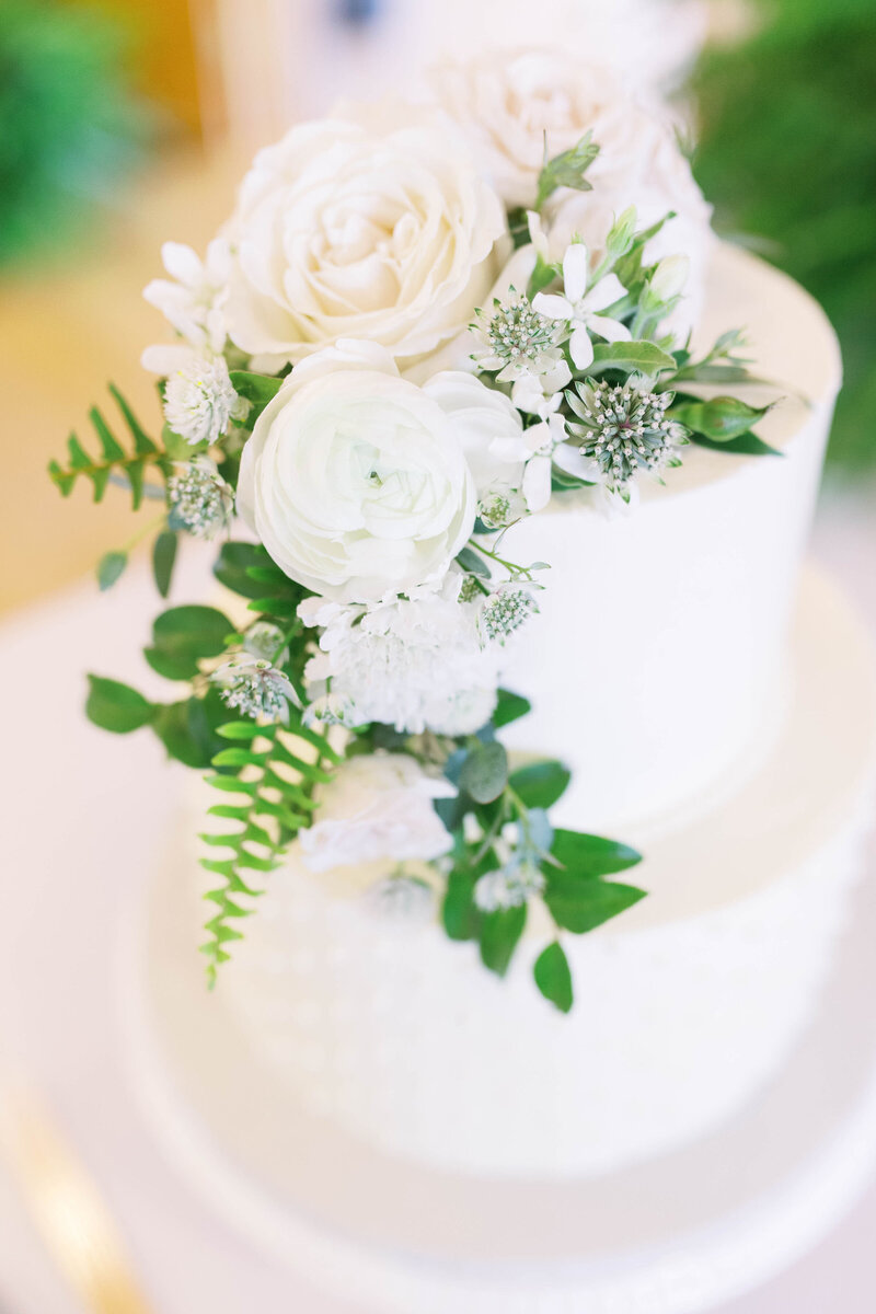 beautiful white and greenery wedding cake, photo by Cynthia Mae Photography Grand Rapids Wedding Photographer