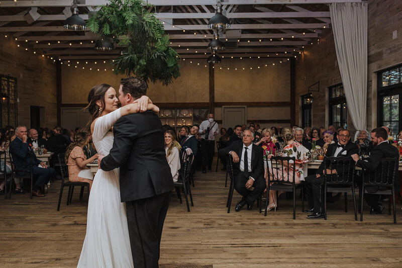 A couple about to kiss during their first dance