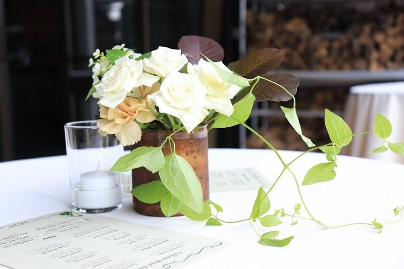 Photo of a boquet of flowers on a desk.