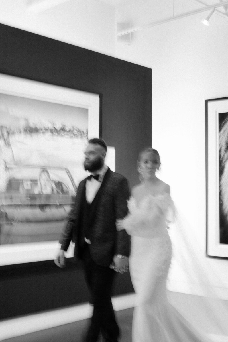 the-bride-and-the-groom-are-walking-at-the-gallery