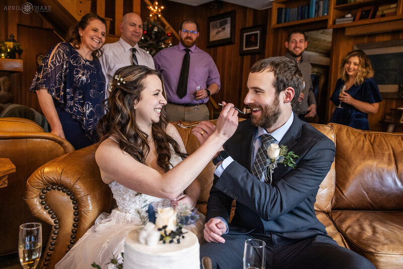 Couple eat their wedding cake at Romantic Riversong Inn