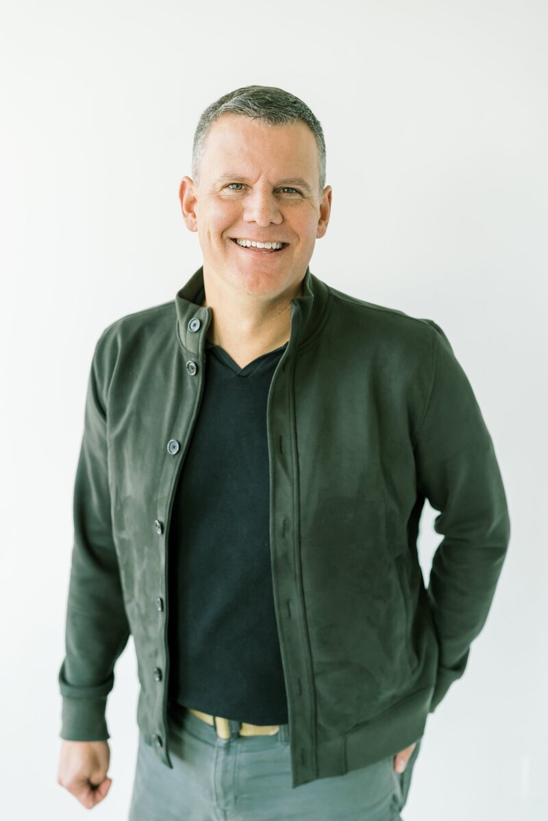 Man smiling at the camera.