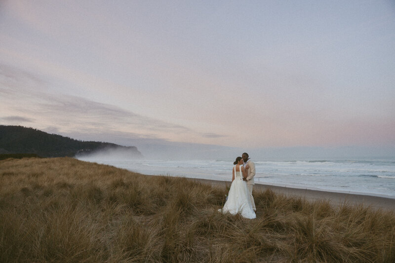 Couple exchanging vows on a secluded beach in Tofino, captured  by Vancouver Island photographer Rae Terrillon Photography
