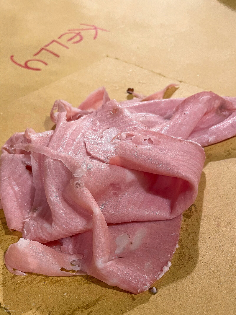 Fresh cut mortadella at Trattoria Molinara in Verona, Italy